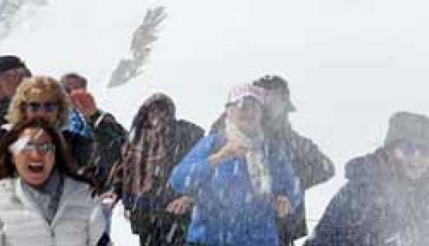 Iran Group Tour participants enjoying snow