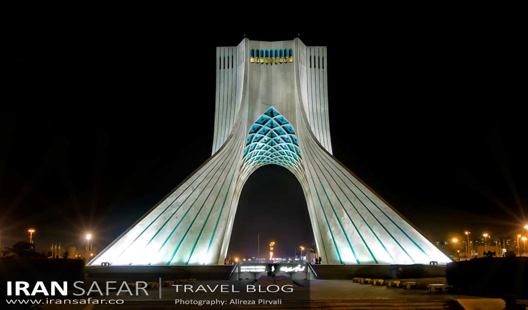 Azadi Tower of Tehran illuminated at night 