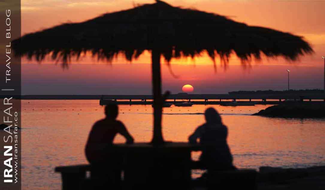 A couple watching sunset in Kish island